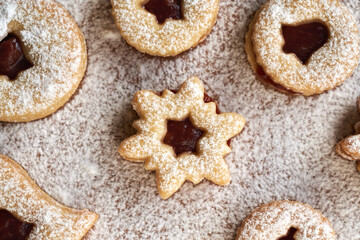 Fototapeta na wymiar Traditonal Linzer Christmas cookies filled with marmalade and dusted with sugar