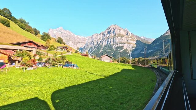 beautiful scenery of switzerland grindelwald from a train inbound to grindelwald. train journey