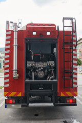 A state-of-the-art firetruck, equipped with advanced rescue technology, stands ready with its skilled firefighting team, prepared to intervene and respond rapidly to emergencies, ensuring the safety