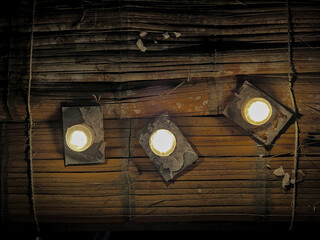 candles on old wooden table with ropes