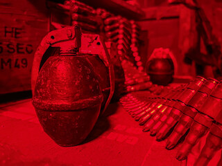 close up of grenade with war boxes and ammunition 
