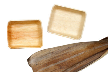 Betel palm leaf plates on white background.