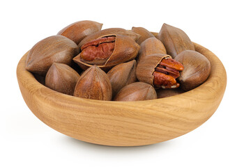 pecan nut in wooden bowl isolated on white background with full depth of field