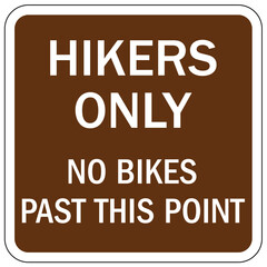 Directional hiking trail safety sign hikers only. no bikes past this point