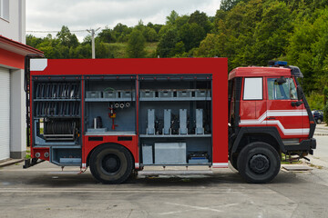 A state-of-the-art firetruck, equipped with advanced rescue technology, stands ready with its skilled firefighting team, prepared to intervene and respond rapidly to emergencies, ensuring the safety