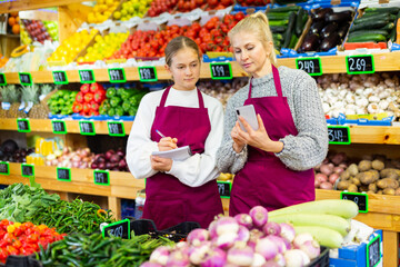 Training at the first job of young girl in a grocery store.