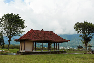 Fototapeta na wymiar The gazebo stands on a cloud-shrouded mountain on the popular tourist island of Bali.