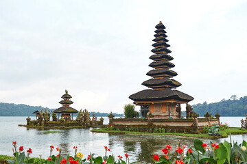 Fototapeta na wymiar Pagoda at the sacred temple of Pura Ulun on Lake Bratan on the popular touristic island of Bali.