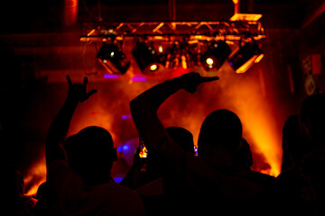 Nightlife and disco concept. Young people are dancing in club or outdoor in sunlight. Happiness,...