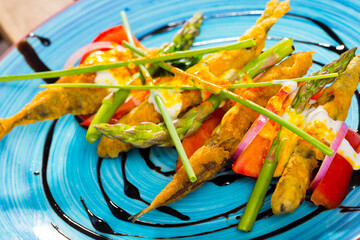 Deliciously fried in batter and creamy-ginger sauce sardines, served with sweet tomatoes and...