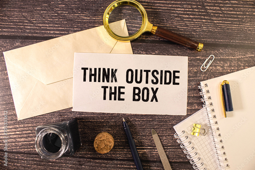 Poster concept image about unconventional or different thinking. think outside the box handwritten