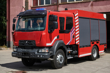 A state-of-the-art firetruck, equipped with advanced rescue technology, stands ready with its...