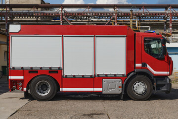 A state-of-the-art firetruck, equipped with advanced rescue technology, stands ready with its...
