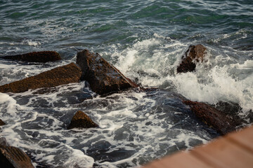 Black Sea waves crashing onto rocks. Wavy sea ocean concept. Storm over the Black Sea.