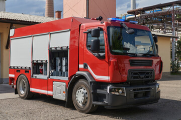 A state-of-the-art firetruck, equipped with advanced rescue technology, stands ready with its...