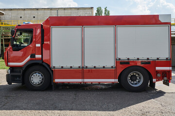 A state-of-the-art firetruck, equipped with advanced rescue technology, stands ready with its skilled firefighting team, prepared to intervene and respond rapidly to emergencies, ensuring the safety