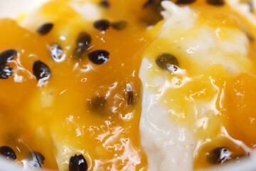dessert known as coconut manjar passion fruit sauce. dessert with passion fruit. dessert details.