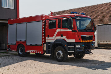 A state-of-the-art firetruck, equipped with advanced rescue technology, stands ready with its...
