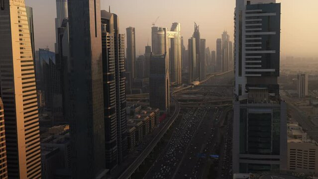 Aerial view of traffic in Sheikh Zayed Road Downtown Dubai at sunset, skyscrapers United Arab Emirates