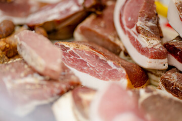 Selection of assorted home made meats, jerky and sausages on a farmers market in Vilnius, Lithuania.