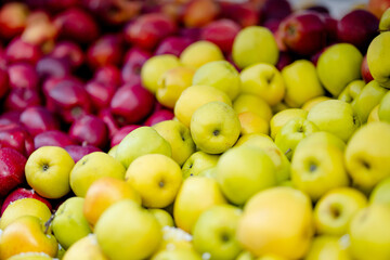Fresh red and yellow apples in wooden crates sold on farmers food market during annual spring fair in Vilnius