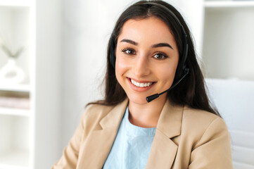 Customer support service. Close-up of arabian or indian pretty woman, call center operator with...