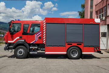 A state-of-the-art firetruck, equipped with advanced rescue technology, stands ready with its...