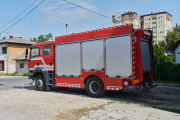 A state-of-the-art firetruck, equipped with advanced rescue technology, stands ready with its skilled firefighting team, prepared to intervene and respond rapidly to emergencies, ensuring the safety