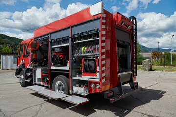 A state-of-the-art firetruck, equipped with advanced rescue technology, stands ready with its...