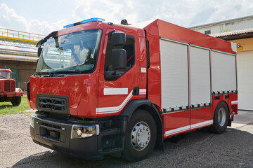 A state-of-the-art firetruck, equipped with advanced rescue technology, stands ready with its...