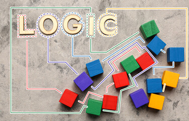 Word LOGIC with colorful cubes on grunge background