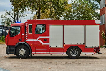 A state-of-the-art firetruck, equipped with advanced rescue technology, stands ready with its...