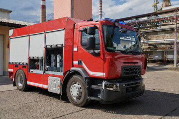A state-of-the-art firetruck, equipped with advanced rescue technology, stands ready with its...