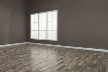 Empty room with brown walls and large window