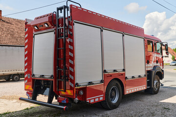 A state-of-the-art firetruck, equipped with advanced rescue technology, stands ready with its skilled firefighting team, prepared to intervene and respond rapidly to emergencies, ensuring the safety