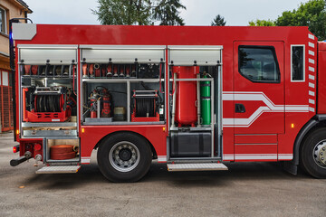 A state-of-the-art firetruck, equipped with advanced rescue technology, stands ready with its...