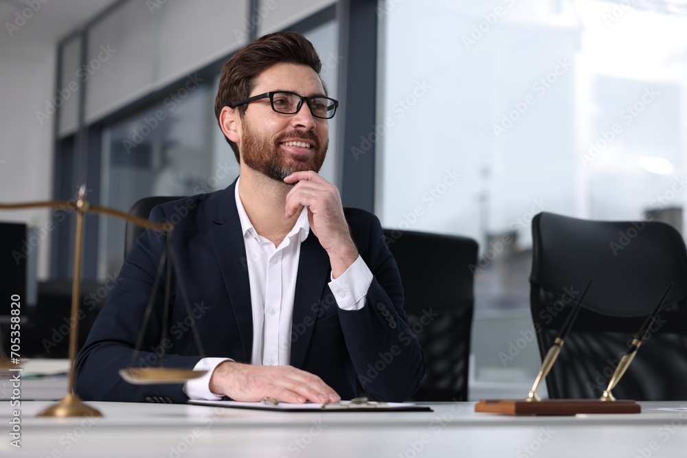 Wall mural Smiling lawyer at table in office, space for text