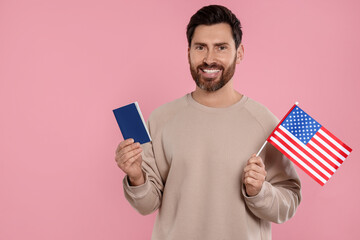 Immigration. Happy man with passport and American flag on pink background, space for text