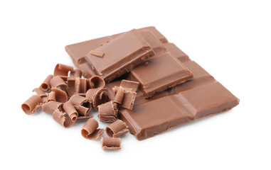 Pieces of tasty chocolate bar and shavings isolated on white