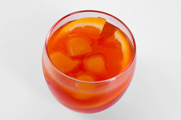 Aperol spritz cocktail and orange slices in glass isolated on white