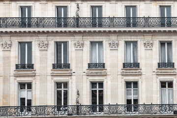Detail of the facade with windows of a building in Paris, France