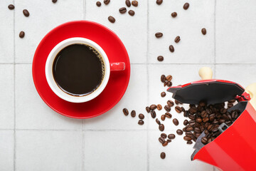 Cup of hot espresso on white tile background