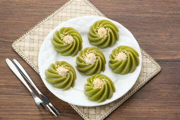 Kue Kaswi Pandan, traditional cake made from tapioca flour and pandan leaf, topping with sesame seed
