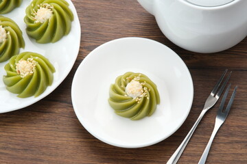 Kue Kaswi Pandan, traditional cake made from tapioca flour and pandan leaf, topping with sesame seed
