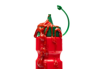 Red ketchup sauce dripping on bottle white background closeup.
