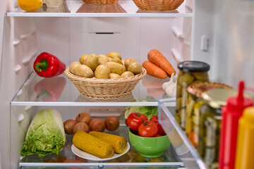 Open fridge full of fresh fruits and vegetables, organic nutrition, 