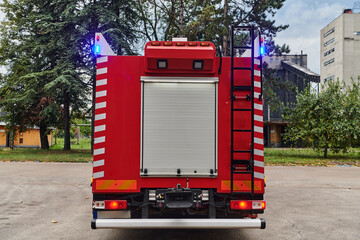 A state-of-the-art firetruck, equipped with advanced rescue technology, stands ready with its...
