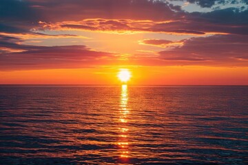 Fiery sunset over a calm ocean horizon