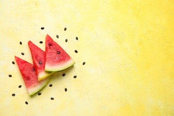 Composition with pieces of ripe fresh watermelon on yellow background
