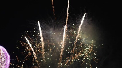 Golden fireworks that actually shine with bokeh lights in the night sky. Fiery fireworks display Fireworks celebration to bid farewell to the old year and welcome the new year